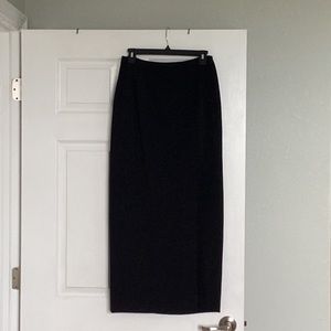 Long, black skirt with slit in front.